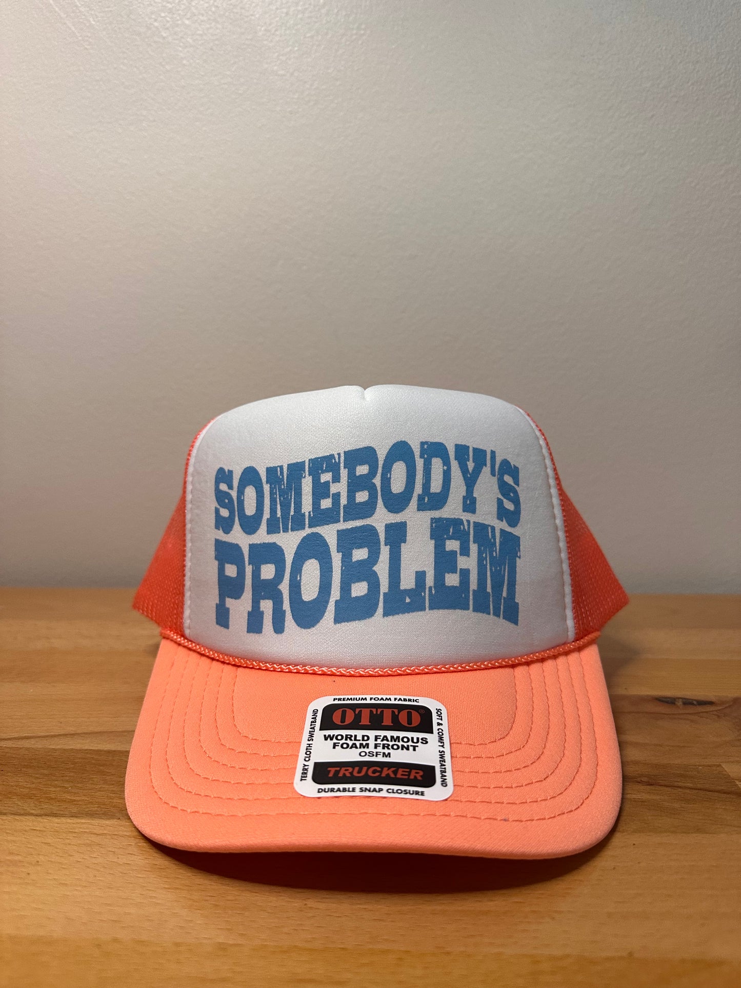 Somebody’s problem Coral foam trucker hat